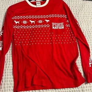 Pink long sleeve shirt, only worn once, no tears or stains.